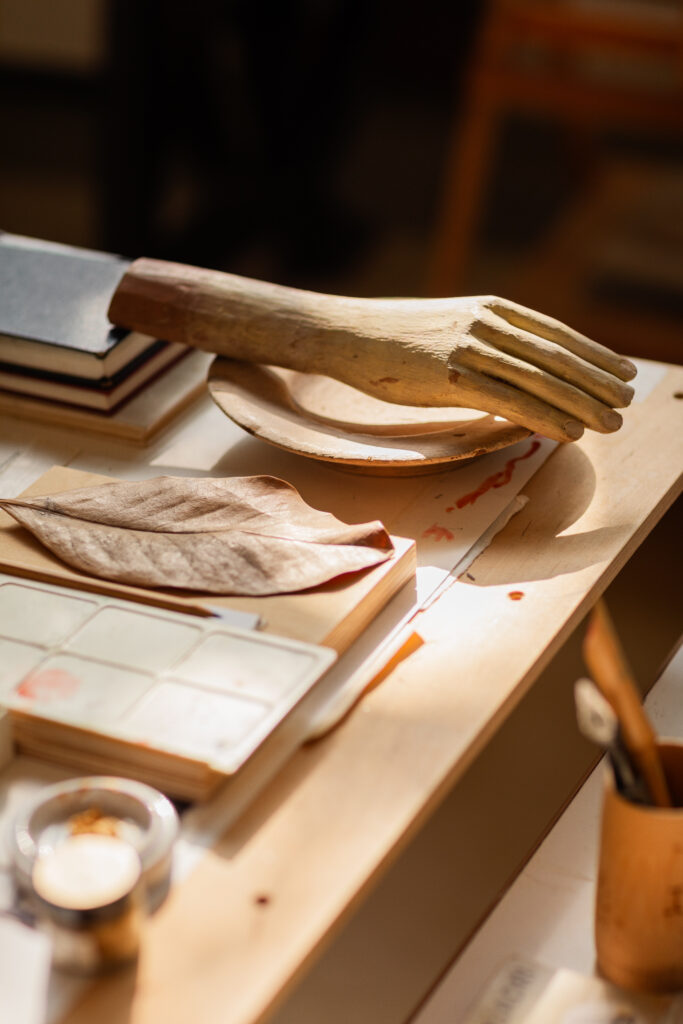 Wooden hand on Irmeli Kukkapuro's desk in Studio Kukkapuro